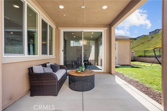 covered patio with lighting and outlet for a fan