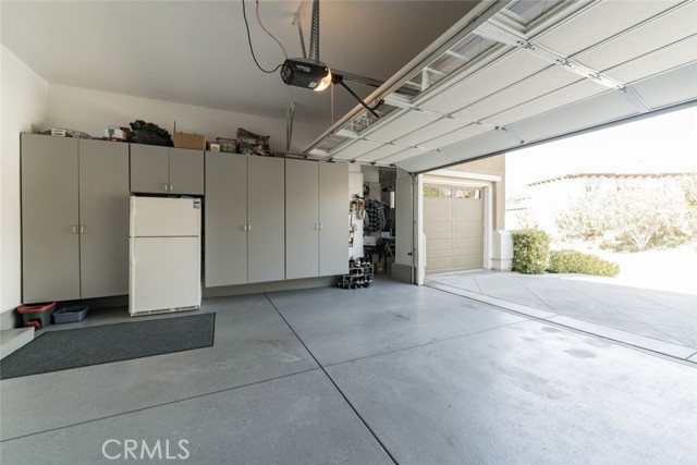 TWO CAR GARAGE W/EPOXY FLOORING & BUILT-IN CABINETS