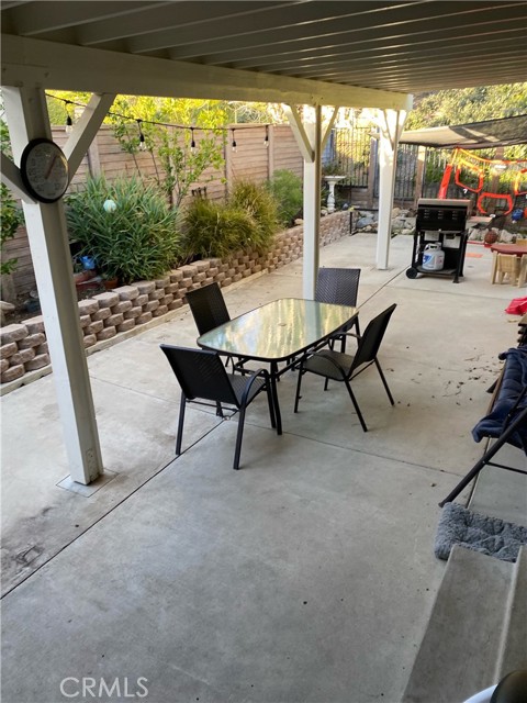 covered patio opening up from living room