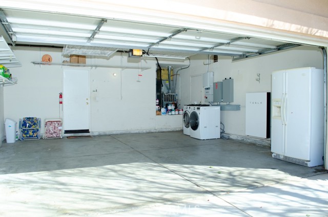 Inside 2 car garage - extra refrigerator included in the sale!