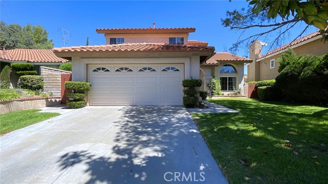 29024 Shadow Valley Lane Saugus, California Bouquet Canyon Estates Home with Hilltop Views & No Rear Neighbors!! This 4 bedroom, 3 bathroom home shows pride of ownership, has an abundant of natural light and is move-in ready. The first level has a bedroom, currently used as an office, and bathroom with walk-in shower. The kitchen features a bay window, white cabinets & granite countertops with a convenient breakfast bar. Kitchen opens to the family room with a cozy fireplace. Wood laminate floors throughout first floor with an indoor laundry room that leads to a 2-car direct access garage, with built in storage cabinets. The master bedroom has a beautiful view of the hills & open space. The master bathroom has double sinks, tub/shower combo and a walk-in closet with additional closet space in bedroom. The backyard is very private, no rear neighbors and a covered patio, the perfect spot for summer evenings. Located close to the end of cul-de-sac, and **NO Mello-Roos and NO HOA!!**. Nearby Central Park, shopping, restaurants & award-winning schools. The perfect place to call home!
