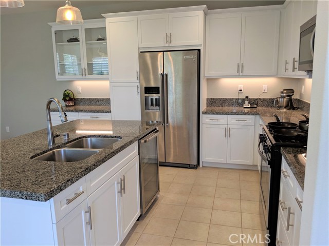 28738 Jardineras Valencia, California JUST REDUCED!!! NO NEED TO WAIT FOR NEW CONSTRUCTION+ BIG SAVINGS $$$ + TOP RATED SCHOOLS WEST CREEK ACADEMY, RIO NORTE JUNIOR HIGH & VALENCIA HIGH.
Beautifully upgraded townhouse with 3 bedrooms plus open loft, 2.5 baths, and a private side yard. This the 3X model the largest of this community corner lot, only 1 shared wall with a front yard, and a great size side yard which is ready for your imagination. This Modern home offers a bright kitchen with a large island, featuring granite countertops in New Caledonia, shaker style white cabinets, Whirlpool stainless steel appliances, and a stainless steel sink. An upgraded add-on glass cabinet in the kitchen with extra recessed lights & electrical outlets. Pre-wire upgrades and modern tile floors on the first level. Light and bright home with upgraded solid basswood plantation shutters throughout. Under stairwell storage. When you're ready to retreat for the evening, head upstairs. This home features a spa-like master bath with white shaker cabinets, cultured marble countertops with a 4" backsplash and a large master shower. There's even a water outlet for an electric toilet. Association amenities include a pool, spa/hot tub, picnic area, playground, sport court, biking trails, and clubhouse. As part of the West Creek community, the home is near greenbelts, schools, paseos, and shopping. DON'T MISS THIS OPPORTUNITY!!