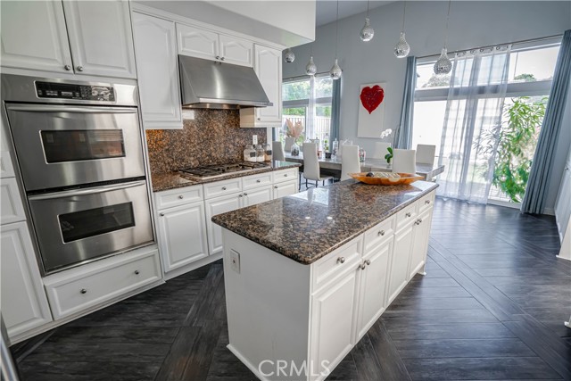 Open Kitchen with Double Stainless Steel Appliances