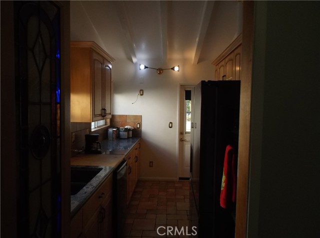 View of galley kitchen from dining area.