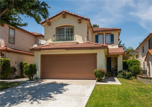 25837 Wordsworth Lane Stevenson Ranch, California In the quaint Verona neighborhood community of Stevenson Ranch you'll find this adorable 3 bedrooms 3 bath home with large loft! At 2158 square feet, the formal living room and dining room flow from the front entry with high ceilings throughout. Custom kitchen with granite kitchen island and countertops opens up to the family room with a fireplace creating a cozy heart of the home. Downstairs flooring is Pergo and Tile, and upstairs all bedrooms are carpeted. Direct access 2 car garage w/storage. Backyard is private and serene with mature trees for privacy and a large slate stone patio for entertaining. Fresh exterior paint and close to Stevenson Ranch Elementary and Richard Rioux Park with access to tennis, basketball, track, playgrounds and views with LOW HOA $30/month.