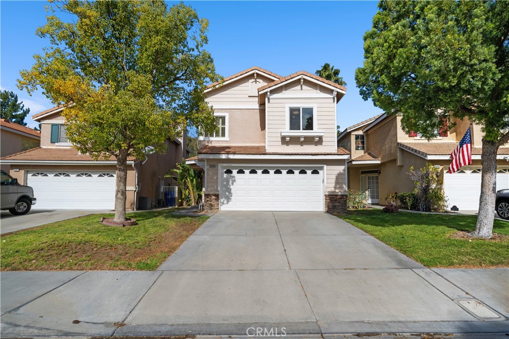 Welcome to Stevenson Ranch, the most sought after community in the Santa Clarita Valley. This beautifully remodeled 4 bedroom, 3 bathroom home boasts almost 2,000 square feet of living space, along with a 2-car garage and a large backyard. As you enter the home, you are greeted with an open living space, large enough to separate the room into two sections. The newly remodeled kitchen is light and bright with gorgeous white cabinets, a kitchen island with bar seating, quartz countertops, stainless steel appliances and sliding glass doors to the backyard. The kitchen is adjoined by a dining area/family room with a gas fireplace. The Primary Suite features vaulted ceilings, laminate floors, recessed lights, a walk-in closet, a large private balcony spanning the width of the home, and a beautifully remodeled Primary Bathroom with dual sink vanity and a separate shower and soaking tub. The three other adjoining bedrooms are located on the second level and also feature recessed lights, window shutters, and laminate flooring. At the landing on the second level, you will find a laundry closet with side by side washer and dryer. 
Upgrades include new kitchen cabinets and countertops, remodeled bathrooms, two zone HVAC system with Nest thermostat, dual pane windows, Solar panels, new doors, tile and laminate flooring, new water heater, sliding glass doors, garage door, new balcony flooring, window shutters, recessed lights, and more. The exterior of the property features a large backyard with beautiful open lawn space, a gazebo, and side yard with great space for a barbecue and more storage. 
Close to Blue Ribbon Schools such as Pico Elementary, minutes away from Richard Rioux Park and the 5-Fwy, this Low HOA and NO MELLO ROOS community is well maintained and has great pride of ownership.