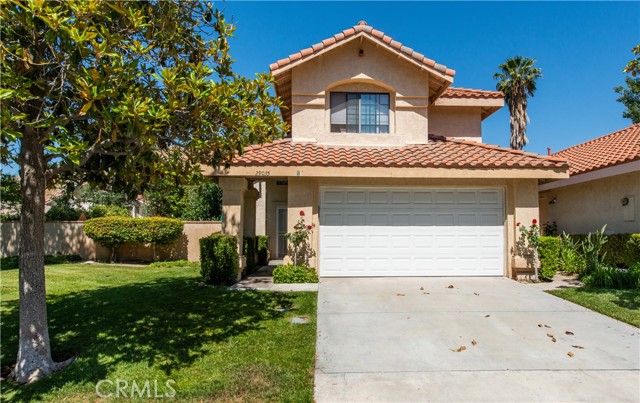29035 Marilyn Drive Canyon Country, California Beautiful 4 bedroom 3 bath American Beauty home located in the heart of the American Beauty tree lined neighborhood. As you walk in, you will notice the magnificent vaulted ceilings! The open kitchen has granite, distressed cabinetry and a dining area that is open to the family room with a dual fireplace connected to the large living area and formal dining room. The Master bath features over sized travertine, glass and marble shower, spa tub and custom counters. The HUGE entertainers backyard has a covered patio with fans for those hot summer days and immaculate landscaping. There is a ton of privacy with no neighbors on one side. The community amenities includes front yard maintenance, pool, spa, tennis courts and trash. The pool and tennis court are just steps away from this adorable home!!! Conveniently located near restaurants, shopping and easy freeway access!!! Welcome HOME!