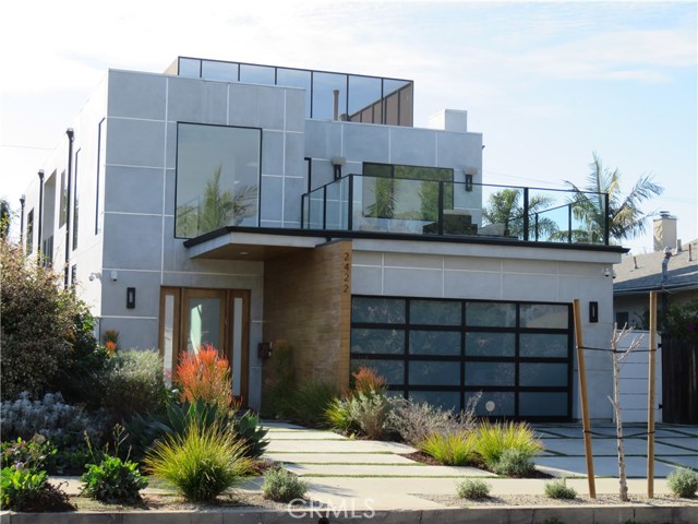 2422 32nd Street Santa Monica, California ARCHITECTURAL MASTERPIECE IN SUNSET PARK. OPEN FLOOR PLAN, BRILLIANT LIGHT IN EVERY ROOM. DESIGNER KITCHEN – LARGE CENTER ISLAND, WOLF AND SUB ZERO APPLIANCES, CAESARSTONE COUNTERS. HUGE FAMILY ROOM – EXPANSIVE GLASS SLIDING DOORS LEADING TO PRIVATE ENTERTAINER’S YARD, WITH BUILT-IN ISLAND BBQ. ALL EN-SUITE BEDROOMS, DOWNSTAIRS GUEST BEDROOM AND BATH. LUXURIOUS MASTER – HIS AND HERS WALK-IN CLOSETS, ENORMOUS BATHROOM – SOAKING TUB, DOUBLE SHOWER AND FLOATING VANITY. HUGE FRONT BALCONY WITH VIEWS, SKYLIGHTS, WOOD FLOORS, TANKLESS WATER HEATER, RECESSED LIGHTS, ALARM, SOUND SYSTEM. CLOSE TO RESTAURANTS AND TRADER JOES.