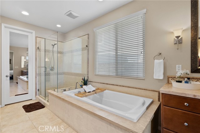 Master bathroom soaking tub and walk in closet.