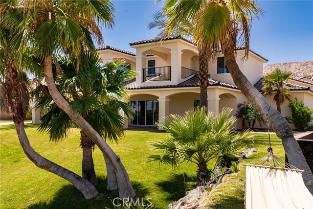 Rear view of home and yard.