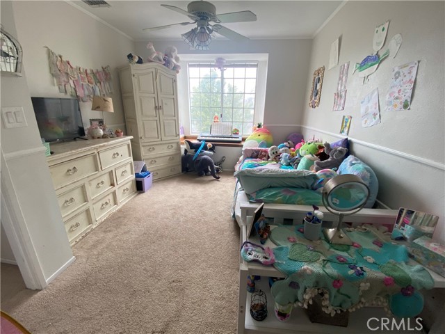 Bedroom #2 with large built-in window seat, chair rail and crown moulding