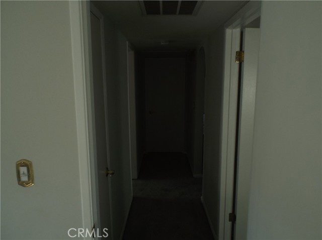 Hallway looking from rear bedroom toward front bedroom.