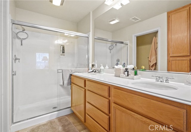 Attached Master Bath featuring dual sink vanity and oversize shower