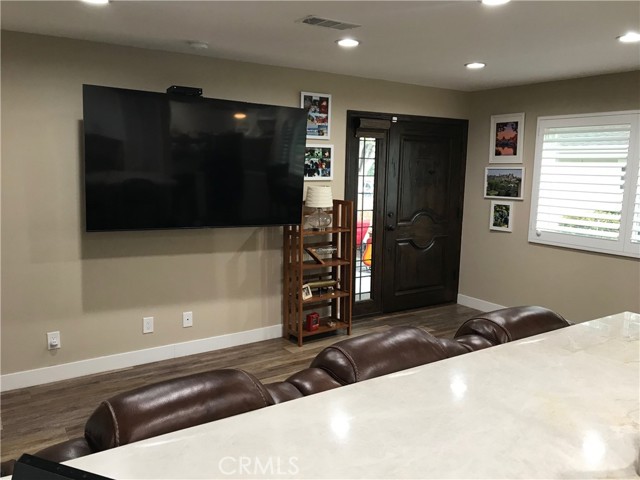 View of living room and elaborate front door from kitchen counter