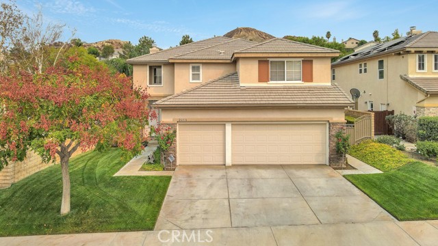 26516 Starling Court Canyon Country, California You’ve waited, and now it’s HERE!!! Located in the highly sought after and desired community of Oak Glen in Fair Oaks Ranch with No Mello Roos, this beauty is situated on a small cul-de-sac street and offers 5 bedrooms, 3 full baths and almost 3000 square feet of spacious, light filled living space on a nice pool sized lot. This wonderful home is within minutes to the community park, shopping, restaurants and easy freeway access. From the minute you walk up to this well maintained 2 story home you will be in love. Featuring beautiful double door entry, an open floor plan with soaring ceilings, a formal living room and separate dining room with buffet/butlers area, and a cooks kitchen with center island, tons of cabinet and counter space, a pantry, breakfast bar and built in appliances (with a near new cooktop and oven), all overlooking a comfortable family room with fireplace - perfect for entertaining with family and friends. 4 bedrooms up and convenient downstairs bedroom and full bathroom. The master suite is spacious with a sitting area, his & her walk-in closets and a full en-suite master bath with tub and separate shower, dual sinks and vanity area. Secondary bedrooms and baths are ample sized, including an oversized one that could be a perfect home media room, office, bonus room and more! A possible pool sized rear yard offers manicured lawn, a wonderful playset, vegetable garden, fruit tree and large patio area. Indoor laundry room, direct access 3 car garage with added finished storage access and electric car charging station. Original owners have taken great care of this one. Community park is just a short stroll and offers, sports court, playground, and picnic area. Homes like this don’t stay around long, see it TODAY!
