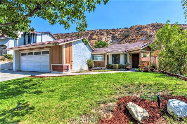 29164 Poppy Meadow Street Canyon Country, California The home you have been looking for has officially arrived. As you drive up to this beautiful, single story home you will notice the natural backdrop of the surrounding canyons. The nicely landscaped front yard leads to the conveniently located porch, a great place for coffee in the morning or watching the stars at night. Inside the open concept living area serves as the center of home with the surrounding bedrooms and kitchen ideally located, which gives it a spacious feel. The master bedroom features a walk in closet and private master bathroom. Between the living area and kitchen you have an open back patio area, perfect for outside dining and entertaining. The enormous backyard has so much useable space, and a large tree in the middle providing shade for the warner weather. The side yard has a gated separation that could be a dog run or a nice place for a garden. Located near freeways, schools, shopping, and community parks you won’t be far from anything you need. No HOA or Mello Roos