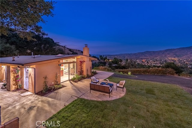1040 LOMA Lane Simi Valley, California SECLUDED & PRIVATE CUSTOM BUILT HOME WITH DRAMATIC & BREATHTAKING VIEWS! PERCHED ATOP THE MOUNTAINS IN SOUGHT AFTER SANTA SUSANA KNOLLS. PERFECT FOR ENTERTAINING WITH LARGE FLAT YARD & OPEN FLOOR PLAN, TONS OF ROOM FOR EXPANSION ON THE OVER HALF ACRE LOT. GORGEOUS & MAJESTIC OAK TREES SURROUND THE AREA ALLOWING YOU TO TAKE IN THE NATURE. THIS HOME OFFERS MANY UPGRADES THROUGHOUT. GALLEY STYLE KITCHEN HAS GRANITE COUNTER TOPS, STAINLESS STEEL APPLIANCES, NEW CABINETRY & TRACK LIGHTING. FORMAL DINING AREA WITH SKYLIGHT & SLIDING GLASS DOOR LEADING OUT TO REAR PATIO. MASTER BEDROOM HAS LARGE CLOSET OFFERING, HIGH CEILINGS AND EN-SUITE BATH WITH NEWER VANITY. GUEST BEDROOM OFFERS AMAZING VIEWS AND PRIVATE PATIO WITH SLIDING GLASS DOOR ALLOWING YOU TO TAKE IN THE BEAUTIFUL VIEWS, SERENE SETTING & WARMTH FROM THE COZY OUTDOOR FIREPLACE. THIS PROPERTY OFFERS MANY SITTING AREAS, ROOM FOR POOL, ADU'S, VINEYARD OR HOME ADDITION. BRING YOUR IMAGINATION TO THIS ONE OF A KIND HOME WITH SO MANY POSSIBILITIES AND OPTIONS.