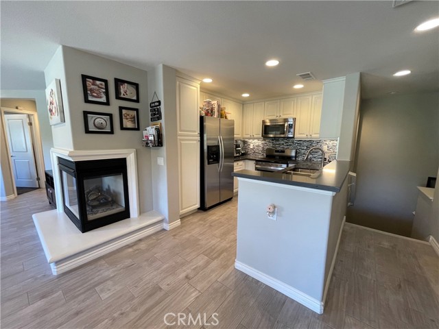 Kitchen with corner fireplace