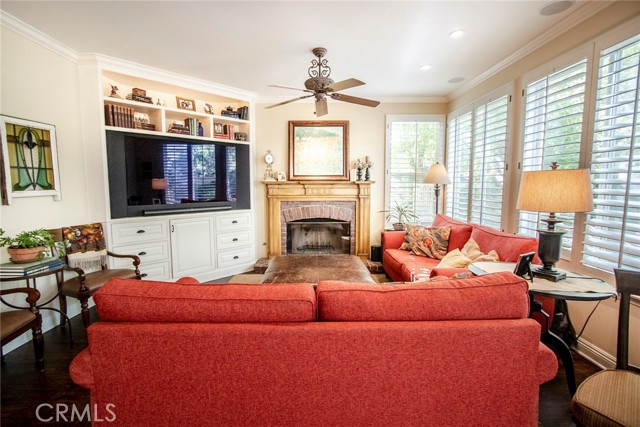 Lovely family room boasting cozy fireplace and wonderful built ins.