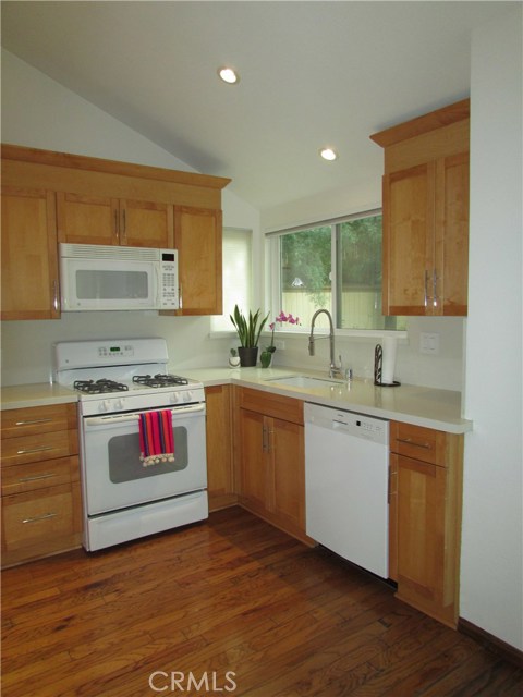 Custom kitchen with loads of cabinetry, Caesar stone solid surface counters and splash and Siemans dishwasher.