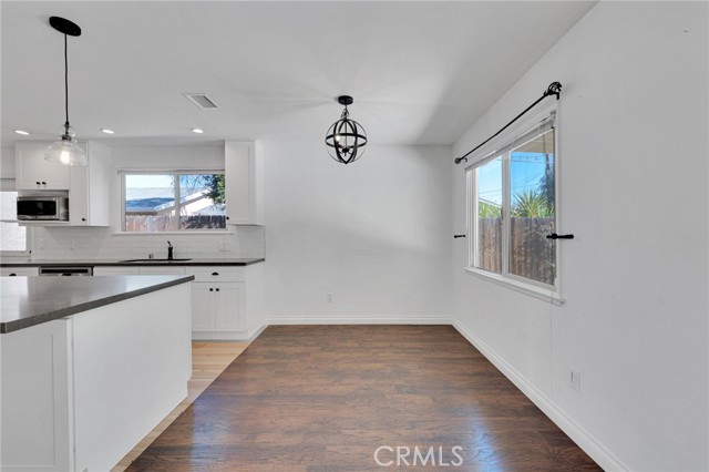 The dining room fittingly adjoins the kitchen and with its sparkling picture window and modern lighting it is perfect for any occasion.