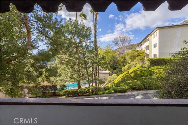 Balcony with mountain and pool view