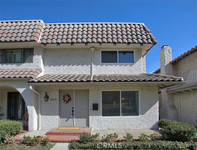 24317 La Glorita Circle Newhall, California Awesome 2 bedroom Condo in the Beautiful Del Prado Community. Gorgeous hardwood and tile floors throughout the downstairs. Beautiful Crown molding and baseboards. This spacious floor plan offers a large living room with fireplace, formal dining room and open kitchen with breakfast nook. Kitchen is light and bright and offers lots of cupboards and counter space plus stainless steel appliances. Upgraded bathroom upstairs with marble tile floors, 2 separate vanities, re-glazed bathtub with subway tile shower surround. There is a large private covered patio with direct access to a two car garage. Share only 1 wall- end unit. Lots of Privacy! View of the serene greenbelt. Clubhouse, pool and spa are walking distance. Central location to freeway access, shopping and schools. Don't miss this one! It will go fast!