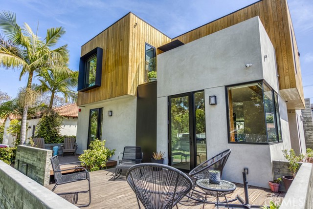 2916 Kansas Avenue Santa Monica, California Welcome to Kansas, an award winning family home on a quiet cul-de-sac in Sunset Park of Santa Monica. Completed in 2020 by Farnsworth Builders and designed by AAHA Studio. “Best of La Cantina 2020” award winner and submitted for the prestigious AIA Award. This contemporary residence is defined by large volumes strategically offset to create entry points, outdoor terraces, and shading throughout the day. A floating full-length boardwalk draws you through to the side/main entrance surrounded by lush new landscaping. The main living space with entertainers kitchen, is anchored by a 22’ wide sliding glass pocket door for that indoor/outdoor living experience. Polished concrete floor runs continuously from the kitchen through the back yard with the door track surgically embedded into the slab. The home is layered with custom fabricated, warm walnut millwork deliberately set against the cool of the poured concrete floors. Wide-plank oak floors provide a tonal contrast at the entry level, upper level bedrooms, staircase and hallways. Oak cabinetry accents in bathrooms offset by full length, gray marble slabs. Ample storage was provided wherever space allowed to ensure that the contents of family life can be tucked away. Detached garage with modern EV charging and alley access, make for a simple ADU conversion. With a fabulous walkable score and close to the trendiest restaurants, shops, parks and freeway access, make Kansas a very attractive purchase.