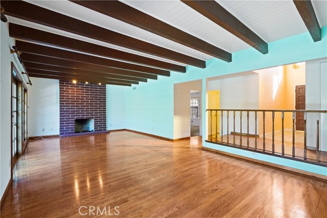 Looking toward the entrance foyer, downstairs .75 bathroom and primary suite