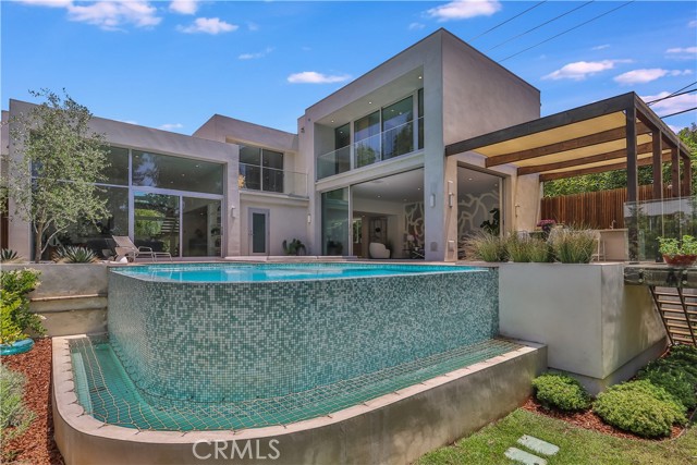 527 S Westgate Avenue Los Angeles, California Attention all Brentwood buyers & agents! Wait till you see this spectacular one of a kind beautiful custom home with fantastic ADU/guest house! Absolute showplace! Right out of a magazine! Fall in love forever here! Amazing quality throughout! Tennis court estate! Incredible heart of Brentwood location! Seconds to everything! Set way back from Westgate on its own gated private driveway! Magnificent post modern home originally designed by the late Richard Winsberg, renowned Los Angeles designer & reimagined for today's lifestyle. All new high-end finishes! Los Angeles gated estate living in Brentwood, complete with tennis court access, sparkling pool & ADU/guest house. Moments to all the amenities & shops Brentwood has to offer. Main home is 4,843 sq.ft with 6 bedrooms (all with En-Suite bathrooms), 7 bathrooms (including outside pool bath) & a private legal ADU/guest house is 769 sq.ft with it's own courtyard/patio, kitchen & bathroom. Entertainer's dream home with an indoor wet bar, private back yard with outdoor bar/grill, sparkling pool, inviting spa & fire pit that seats 10+. Outstanding floor plan with formal living room, large dining room with wall to wall wine cellar, open concept chef’s kitchen & fabulous family room with walls of retractable glass and concealed floor TV lift. Upstairs den/game room. Separate marvelous main bedroom wing accessed by floating bridge complete with high end designer closet, marble slab steam shower & motorized skylight. Enjoy the private tennis court (shared with two other homes on the private driveway). Complete with home audio and security system. Astonishing location with Brentwood Village at your fingertips! Rare offering! If you are only seeing one extraordinary Brentwood home with an exceptional ADU/guest house, pool & tennis court In the price range, make sure this is it! Must see! Do not miss! Brentwood living at its best!