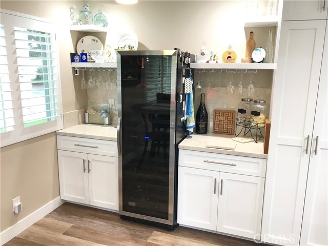 Custom dry bar with large wine refrigerator
