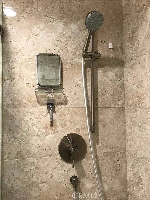 Shower diverter valve to alternate between hand-held and rainshower fixtures