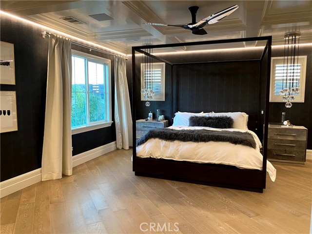 Primary Bedroom with designer wallpaper and coffered ceilings