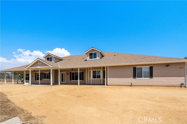 10727 Cleat Road Agua Dulce, California Welcome friends and family into open, inviting spaces where there’s plenty of room to entertain, play games or hunker down for a cozy night in. Located in the heart of Agua Dulce but just minutes from Vasquez Rocks, the 14 and Santa Clarita sits this Custom Ranch Style Home on over 4 acres for those who long for country living.Step inside to an airy foyer, formal living room and dining room that flows into an open concept kitchen filled with natural light. The Kitchen boasts a well planned design for cooking while entertaining with center island, granite counters, a large walk in pantry, updated appliances, breakfast bar and nook. The comfortable and inviting family room with fireplace is perfectly located off the kitchen with direct access to the patio. The Primary Bedroom Suite is complete with a fireplace, walk-in closet, expansive en-suite bathroom with jacuzzi tub, walk-in closet, and stunning views! The unfinished second level of this custom ranch can easily be converted into a recreation room, office/craft room or gym. Exterior features such as a covered wrap around patio and a three-bay garage for your vintage vehicles or all of your off-roading toys. The craftsmanship of this property is beautiful and charming with high-quality details throughout.