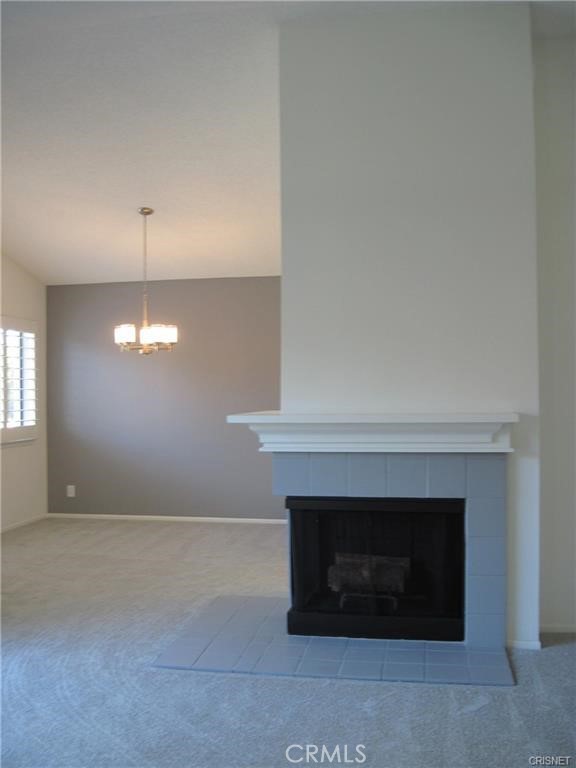 Fireplace in Living room with view to the dining room and kitchen try