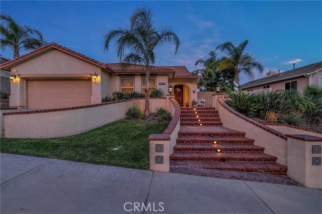 28330 Hawks Ridge Drive Canyon Country, California This Loving Canyon Crest home with great curb appeal offering 4 Bedrooms+ Bonus Room & 3 Baths with over 3100 SQFT is the Home you have been looking for!
Upon entering you'll find a large living/dining area with beautiful hardwood floors that lead to the heart of the home, the kitchen. This upgraded kitchen offers granite countertops, upgraded cabinets, stainless steel appliances, built-in Microwave, convection oven, dishwasher & a newer refrigerator. The kitchen island is a perfect place to gather next to the family room. A UNIQUE FIRST FLOOR MASTER BEDROOM with vaulted ceilings, overlooking the backyard & a large walk-in closet. The spacious Master Bathroom with double sinks offers a separate shower, and a jetted tub. On the first floor, there a guest bedroom with a large closet space, and a full bathroom. This home offers a bonus room, currently used as a bedroom, but it could also be used as an office, music room or library. On the second floor, there are two more well-sized bedrooms and a full bathroom. Other features are Crown Molding, Ceiling fans & laundry room. The front yard is large & green. The Backyard is private and beautifully landscaped with stamped concrete, fruit trees (Peach, Apple, Plum & Lemon) with a Gazebo, beautiful fountain & Spa. There are views of the green belt as well as the hills surrounding this community. This home is in a quiet residential neighborhood, within minutes to freeway access, shops, parks, & Top-rated schools.