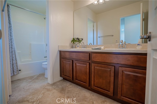 upstairs bathroom with dual sinks