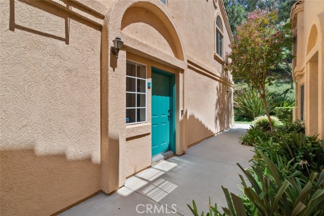 18740 Vista Del Canon E Newhall, California Welcome to Vista del Canon! Poised within a quiet neighborhood in the sought-after city of Newhall, this charming end unit 2-bedroom, 1-bathroom condo is a wonderful starter home in a gated community. Enter first into the neat entryway and be led upstairs to the bright and airy adjoined space of the living room and dining room featuring large windows that effortless draw in natural sunlight, a cozy fireplace framed by neat, tile detailing, and sliding door access out onto the private balcony. Follow the pristine laminate flooring installed throughout and venture into a user-friendly kitchen complete with sizable cabinetry, stone countertops, added shelving, built-in stainless-steel appliances, and recessed lights to fully illuminate the space. Off the living room is the main hallway that leads into two spacious bedrooms fitted with new plush carpet floors and built-in closet storage which feature all new interiors, doors, and fresh paint. The single bathroom housing a double sink vanity, a new bathroom fan, and added shelving. The home includes a good amount of built-in storage space plus an attached 1-car garage featuring a new garage door opener and a convenient area for both washer/dryer units. Multiple improvements have been made to this home, including a new AC blower, upgraded thermostat, door handles, lighting, plus the addition of an alarm system. As part of a pet friendly HOA, residents are welcome to enjoy the community pool and spa while the HOA covers the cost of pest control, security, and more. Vista del Canon conveniently located nearby various shopping centers such as The Plaza at Golden Valley, across the street from Costco, 24-Hour Fitness, local schools, Bothwell Park, hiking trails easy 14 freeway access, and so much more! Discover Newhall today!