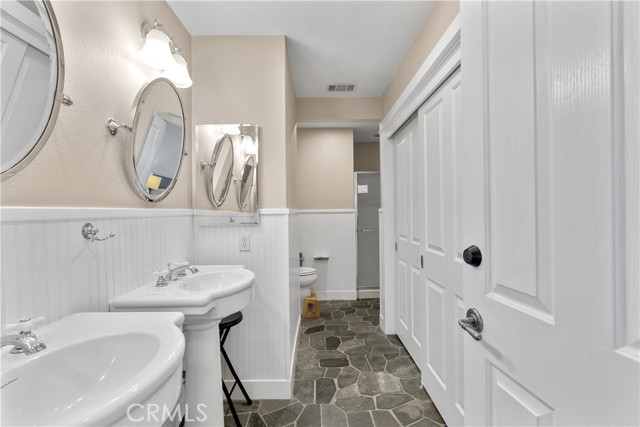 Master Bath with dual sinks and lots of closet space