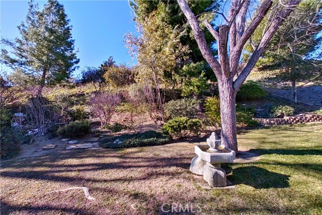 Stone fountain, in backyard, stays with sale