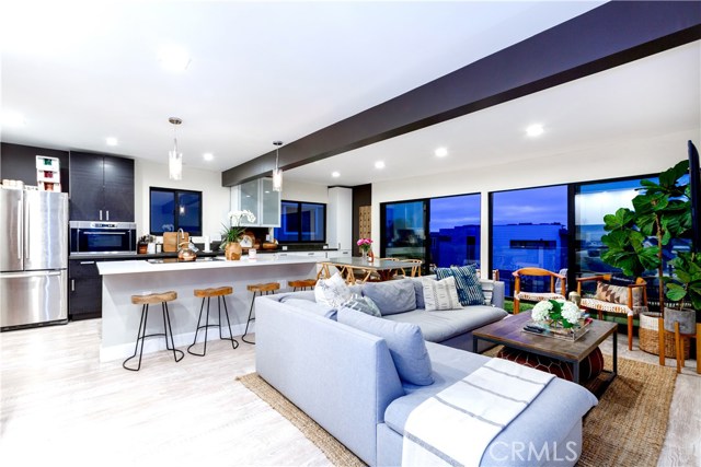 1126 Manhattan Avenue Hermosa Beach, California Striking, Modern Duplex with Ocean Views Steps from Hermosa Beach. This sleek two-unit beach property features two 3-bedroom, 2-bathroom apartments. Each apartment has an open concept living, dining and kitchen area with full-width balconies. Both units are fully renovated with all new Fleetwood sliding doors and windows, engineered wood flooring throughout, recessed lighting, stainless steel appliances, new modern designer bathrooms, new paint, new modern cabinetry and quartzite countertops. The exterior has new stucco and new exterior paint. The entries into both apartments have new exterior doors with lock pads leading into a secure private stairway to each unit’s private front door. 3 Garage spaces attached. Minutes from Hermosa Beach's famous Pier Ave, the best shopping, restaurants, and amenities.