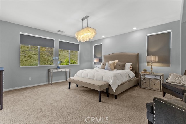 primary bedroom with view of hillside