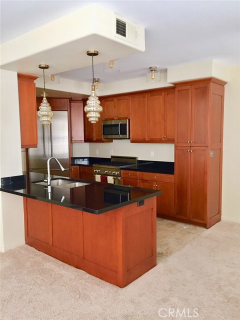 360 W Avenue 26 319 Los Angeles, California Lincoln Heights 3 Bedroom + 2 Bathroom Absolutely Stunning Condo in security building.Gated,luxury "Puerta del Sol development. If you are looking for a home and not just a "rental" you've found it! Bright and airy with tons of windows located on the 3rd floor and away from it all. Some of the highlights and extra features that set this unit apart are: Stainless Steel Thermador built-ins, Wine cooler, Large Pantry with slide outs, Rich Cherry-wood Cabinetry, granite counter tops with breakfast bar, "Edison" light fixtures/pendants, plantation shutters throughout, and ceiling fans in each bedroom. Completing the long list of amenities, is an LG washer and dryer for your own personal use. The master bedroom en-suite in its separate "wing" affords a custom closet and bathroom enhanced by a large soaking tub, and stall shower. 2 tandem parking spaces, a gym, and clubhouse are included with the rent.Relaxing courtyard with fountain and seating. You are only about a 5 minute walk to the Gold Line platform, or nearby Pasadena, DTLA and Union Station, and immediate access to the 5 and 110 freeways.