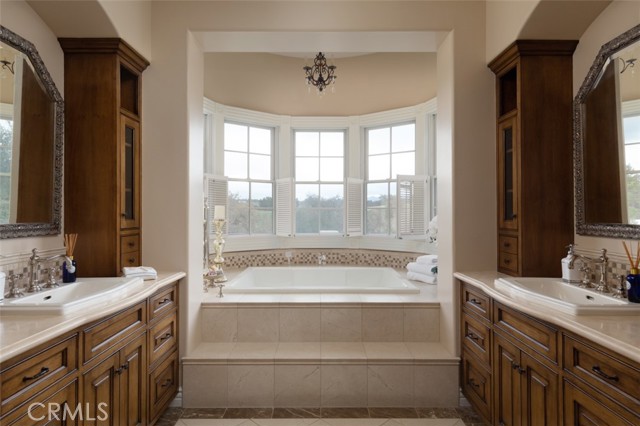 Dual Vanities with travertine counters