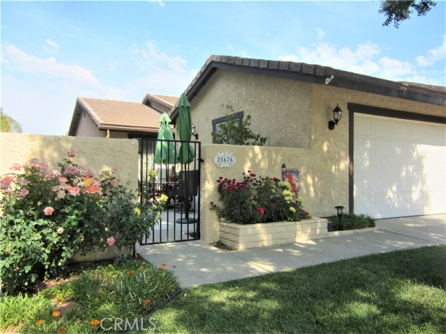 25676 Almendra Drive Valencia, California Updated 3 bedroom, 2 bath Sunrise single story, in the heart of Valencia! Part of the living room wall has been opened to the kitchen, creating a nice flow for entertaining. Walk into the remodeled kitchen, which features quartz countertops, a double pantry, and a brand new stove, a breakfast bar with pendant lighting, a porcelain tile floor and a ceiling fan. Blinds and laminate flooring highlight the living room and all three bedrooms boast ceiling fans, laminate floors and mirrored closet doors. Both bathrooms have been updated, including stone top vanities and tile floors and the master bedroom has a large slider leading to the back patio. Recently re-landscaped, the front and back yards offer colorful flowers and there's a spacious hardscape area, perfect for your patio table and chairs. Located near the end of a cul-de-sac, by a paseo, this home is also just down the street from Almendra Park and close to one of the HOA pools and childrens' play area. Enjoy nearby shopping, restaurants and all that living in Valencia has to offer.