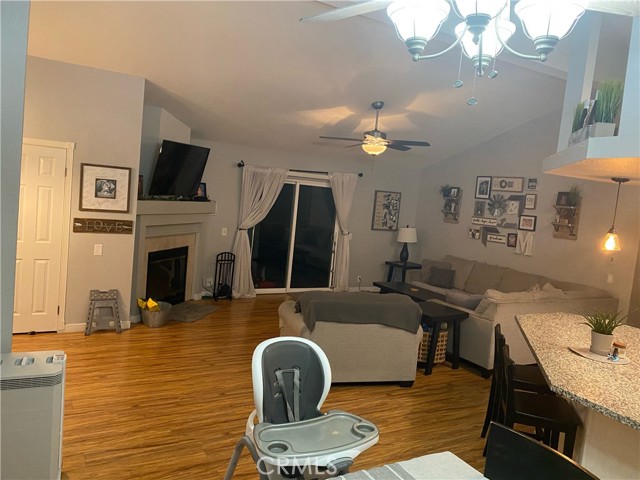 living room  with fireplace and kitchen opening form the dining area