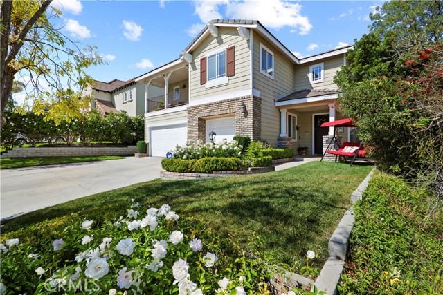 26451 Thackery Lane Stevenson Ranch, California Beautiful Stevenson Ranch Pool Home! Larger Cen-Tex Ridge plan 4 home with Fabulous Curb Appeal located on a cul-de-sac in the lovely Stevenson Ranch Community. Upgraded 4 Bedrooms, 3 baths and a bonus room. Super spacious master suite with fireplace and huge bathroom with walk-in shower and separate soaking tub. Large walk-in master closet. One of the secondary bedrooms is extra large with access to a private verandah with a view. Upstairs laundry room. Large kitchen with Viking appliances, granite countertops and island that opens to a fabulous great room with gas burning fireplace, raised heath and surround sound speakers. There is a formal living room and dining room and also separate eating area in the kitchen. Nice sized bonus room. Attached 3 car garage. Entertainers backyard has a sparkling pool and spa plus an outdoor fireplace and plenty of patio room for entertaining. No rear neighbors. Easy freeway access and close to award winning schools, park, shopping and dining.