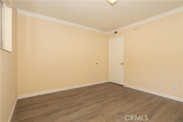 Bedroom with custom closet doors and blinds