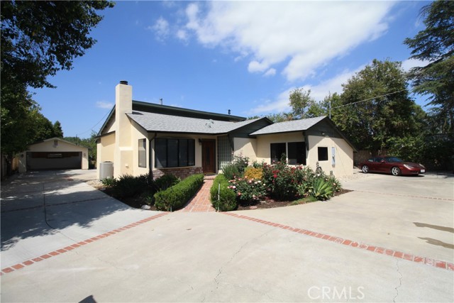 22701 Oxnard Street Woodland Hills, California A rare and exciting opportunity to rent a charming ranch-style home in the heart of Walnut Acres! The large main house has four bedrooms and two and a half baths, with large custom kitchen, dining and living areas. The fourth bedroom can be used as an office and has a separate entrance. Main features include beautiful, original hardwood floors, high end stainless steel appliances, ample kitchen counters and new windows. The home was completely remodeled a few years ago and is on an expansive 28,000+ Square Foot gated lot, with lush landscaping and circular driveway. Remodeling included a new roof, electrical box, kitchen, bathrooms, lighting and plumbing all with permits. The home has central HVAC. An ample driveway provides plenty of parking, while a side area off the west side of the main house is perfect for RV or boat parking. This is a property in a top-rated public school district (El Camino Real Charter High School, Hale Charter Academy, and Woodlake Elementary) with a variety of advantages for families. Come see it before it is gone! A detached one bedroom one bath ADU is on the property. It is currently rented to a quiet single occupancy tenant.
