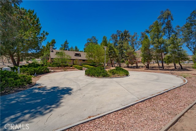 34155 Castlehaven Road Agua Dulce, California First time on the market! Original owner custom built home in the heart of Agua Dulce. Single story 3 bedroom home on 4 usable acres. Open floor-plan with real wood-burning fireplace w/ heatilator, hardwood floors, and a mudroom/laundry room with 3/4 bathroom off kitchen leading to the attached 2 car garage. Home has upgraded dual pane, wood cased Anderson windows, LED lighting, large 4 foot entry and back doors, a 1 year old roof, R16 insulation under raised foundation, R30 above ceiling and bonus storage space above house and garage. The master bedroom has a private bathroom with double sinks and dressing/make up counter. The property features a large circular driveway, 40 plus year old trees and 30 plus year old plants and landscaping. Out back is an attached large storage shed and plenty of room for RV parking or horse facilities. This property has paved road access, 2 working wells, natural gas service, and the rear of the property has a lower section with road access. Also, the adjacent flat and fenced 1 acre lot is available for $150k.